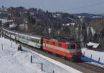 Von Luzern kommend ist die in Swiss-Express-Lackierung gehaltene Re 4/4 II 11108 mit dem VORALPEN-EXPRESS IR 2413 am 16.03.2013 bei Degersheim unterwegs nach Romanshorn.